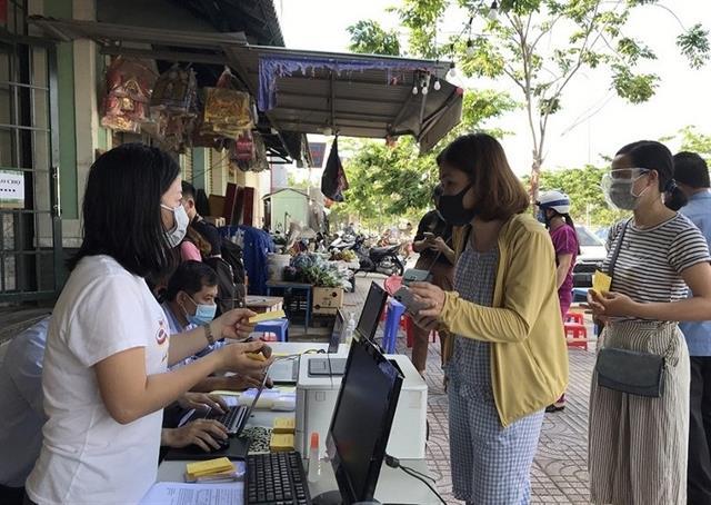 Thu Duc City issues grocery cards, limits shoppers in traditional markets